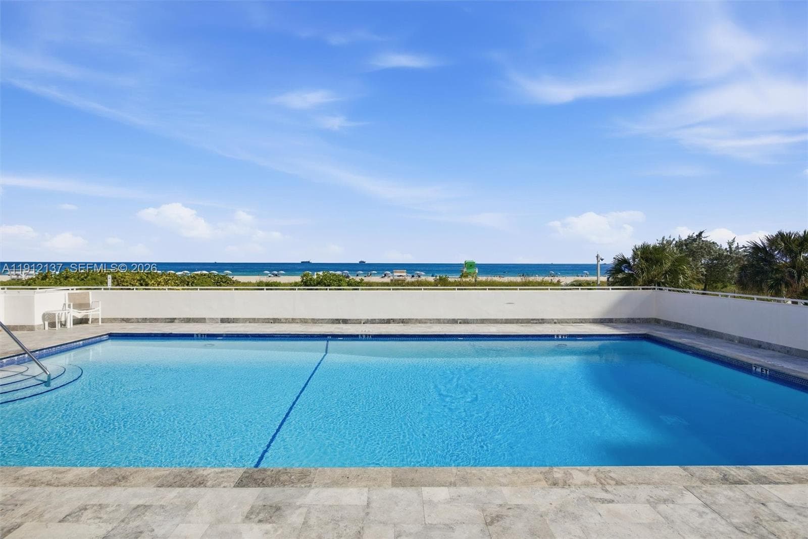 Relax and unwind at this stunning oceanfront pool, where the turquoise waters of the Atlantic create a breathtaking backdrop. The expansive pool deck offers ample space for lounging under the sun, featuring sleek modern furnishings and a serene coastal ambiance. Enjoy a refreshing swim while gazing out at endless ocean views, or spend the afternoon soaking up the sea breeze from a comfortable lounge chair. With direct beach access just steps away, this pool deck perfectly blends resort-style luxury living