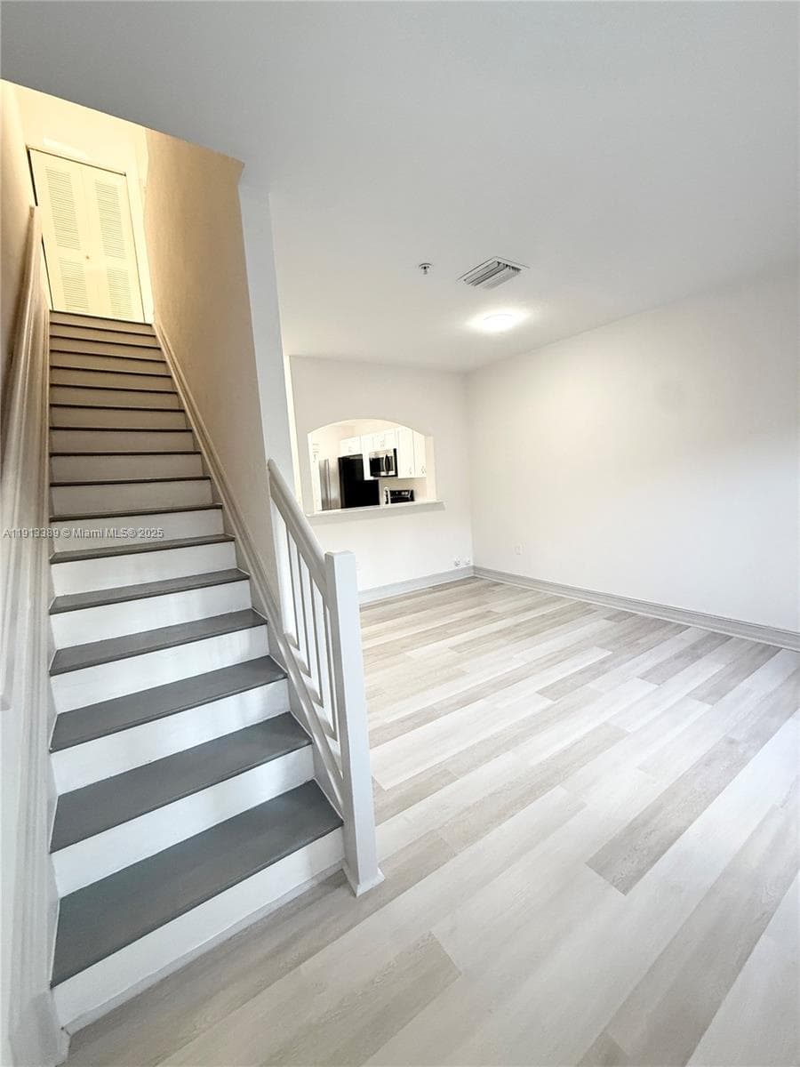 Living/Dining Area & Staircase