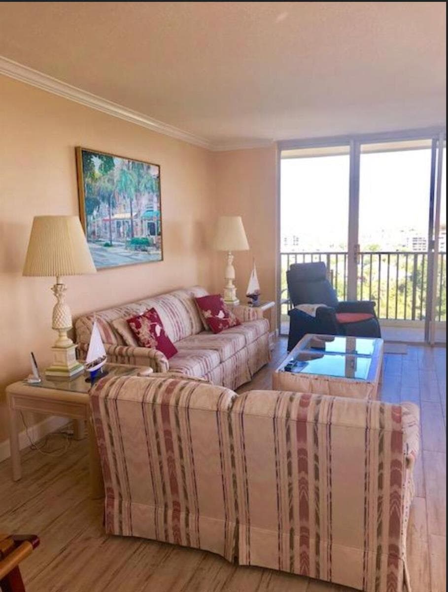 Living room with ocean and park views