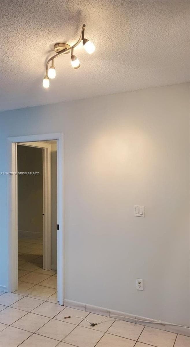 In hall way between bedroom and bathroom