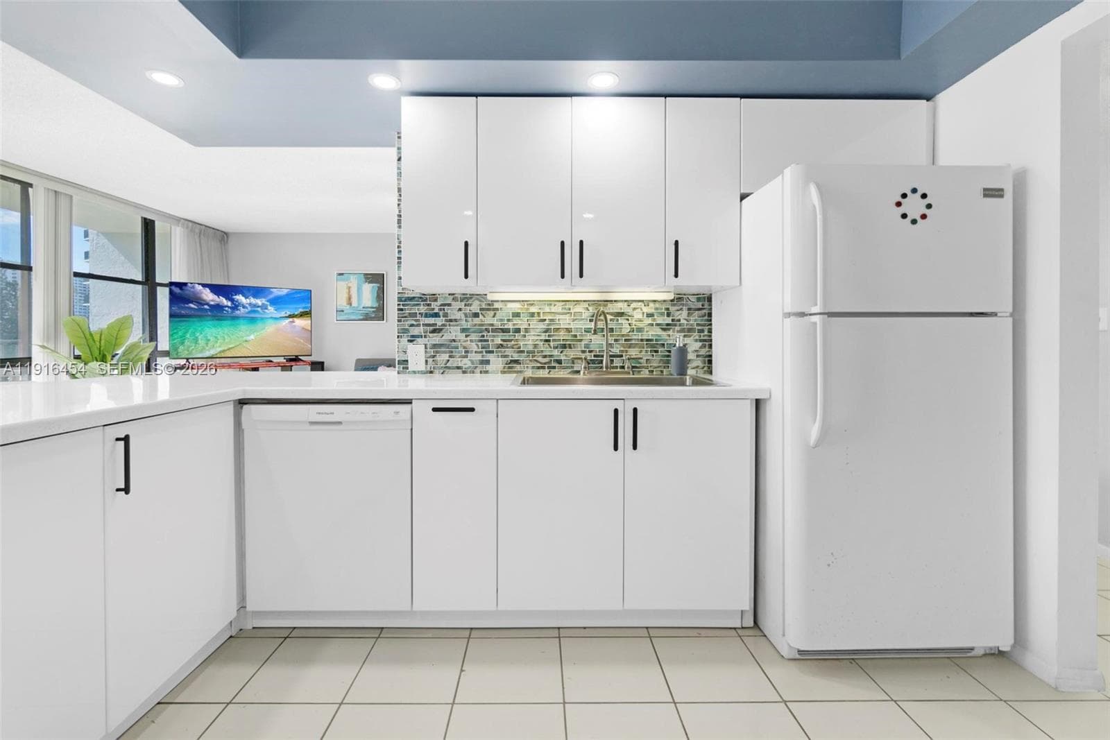 Spacious living room with lots of light and tile flooring. - Oceanview Park Condominium, Three Islands, Hallandale Beach, FL 33009. 1000 Parkview Drive, Unit #518.