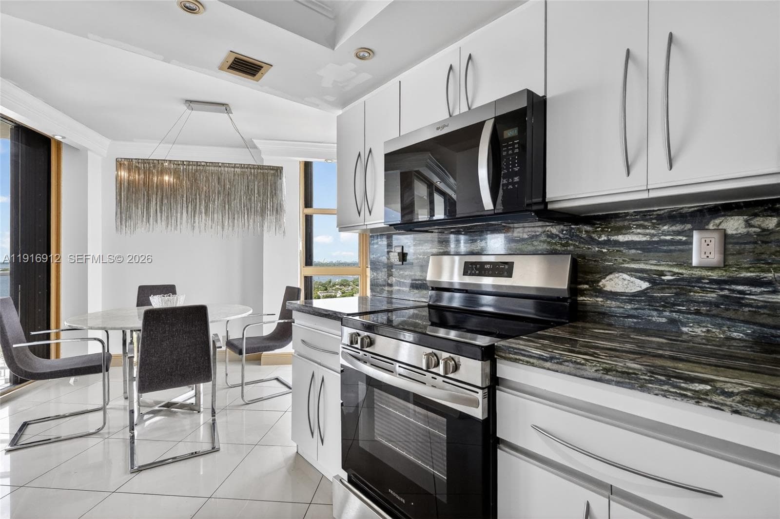 Sleek, brand-new appliances complement the stone’s deep tones, creating a perfect blend of modern luxury and timeless style
