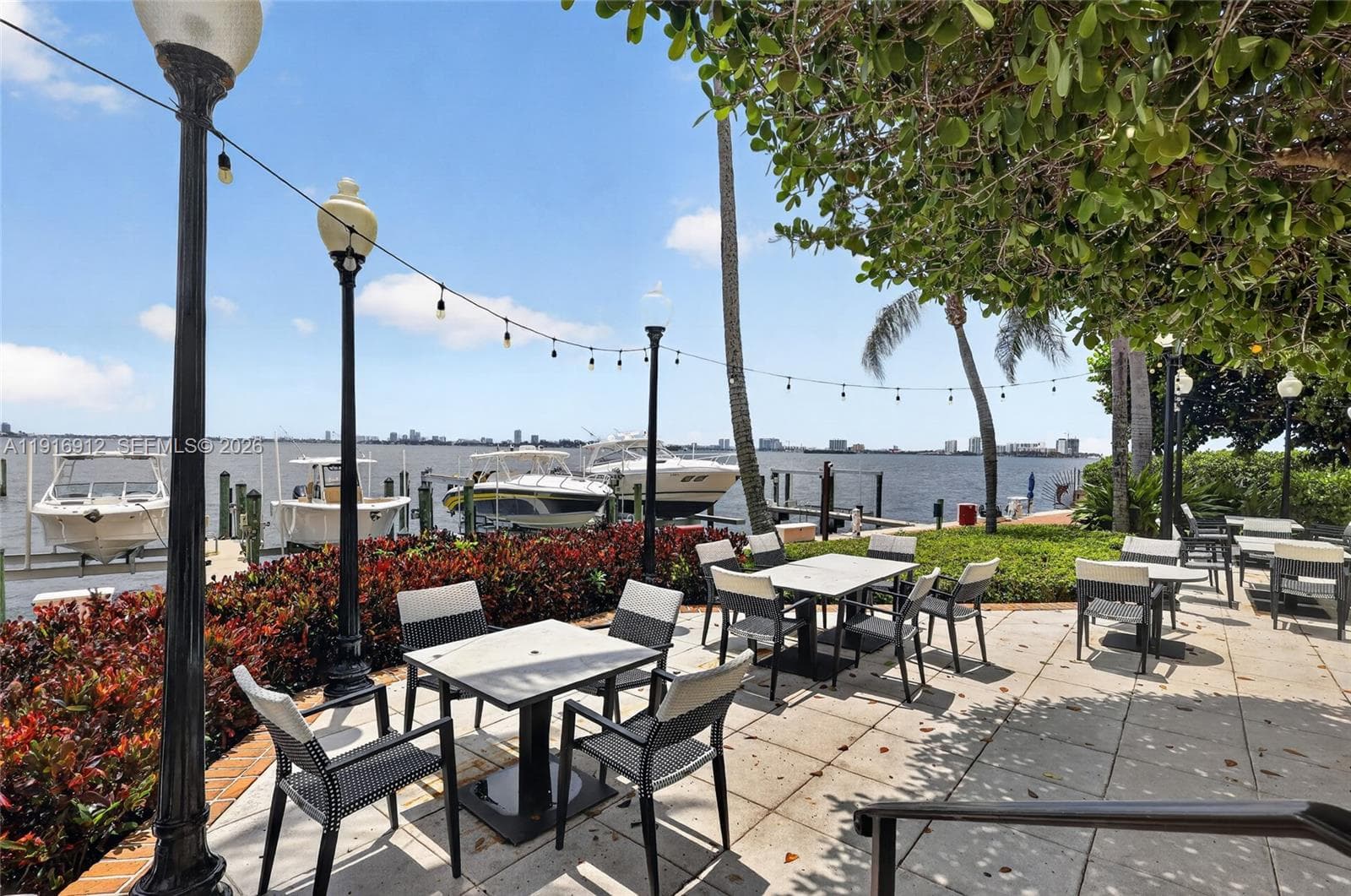 Surrounded by the sight of docked boats and sparkling waterways, the restaurant terrace provides an inviting atmosphere for morning coffee, sunset cocktails, or an evening meal under the stars. Its relaxed yet elegant setting captures the essence of waterfront living and dining at its finest.