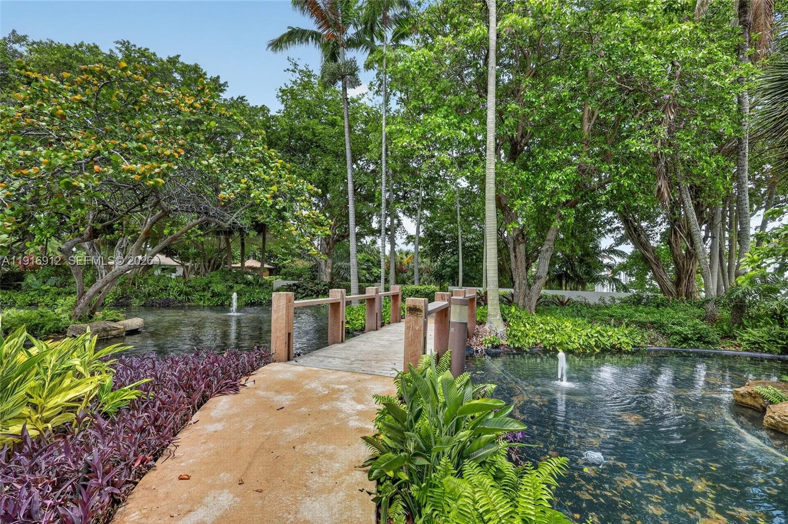 Vibrant community surrounded by lush tropical landscaping, mature trees, and scenic green spaces that create a peaceful, resort-style atmosphere