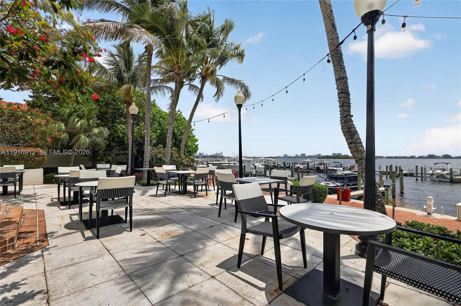 The restaurant’s waterfront terrace offers a stunning open-air dining experience overlooking the marina