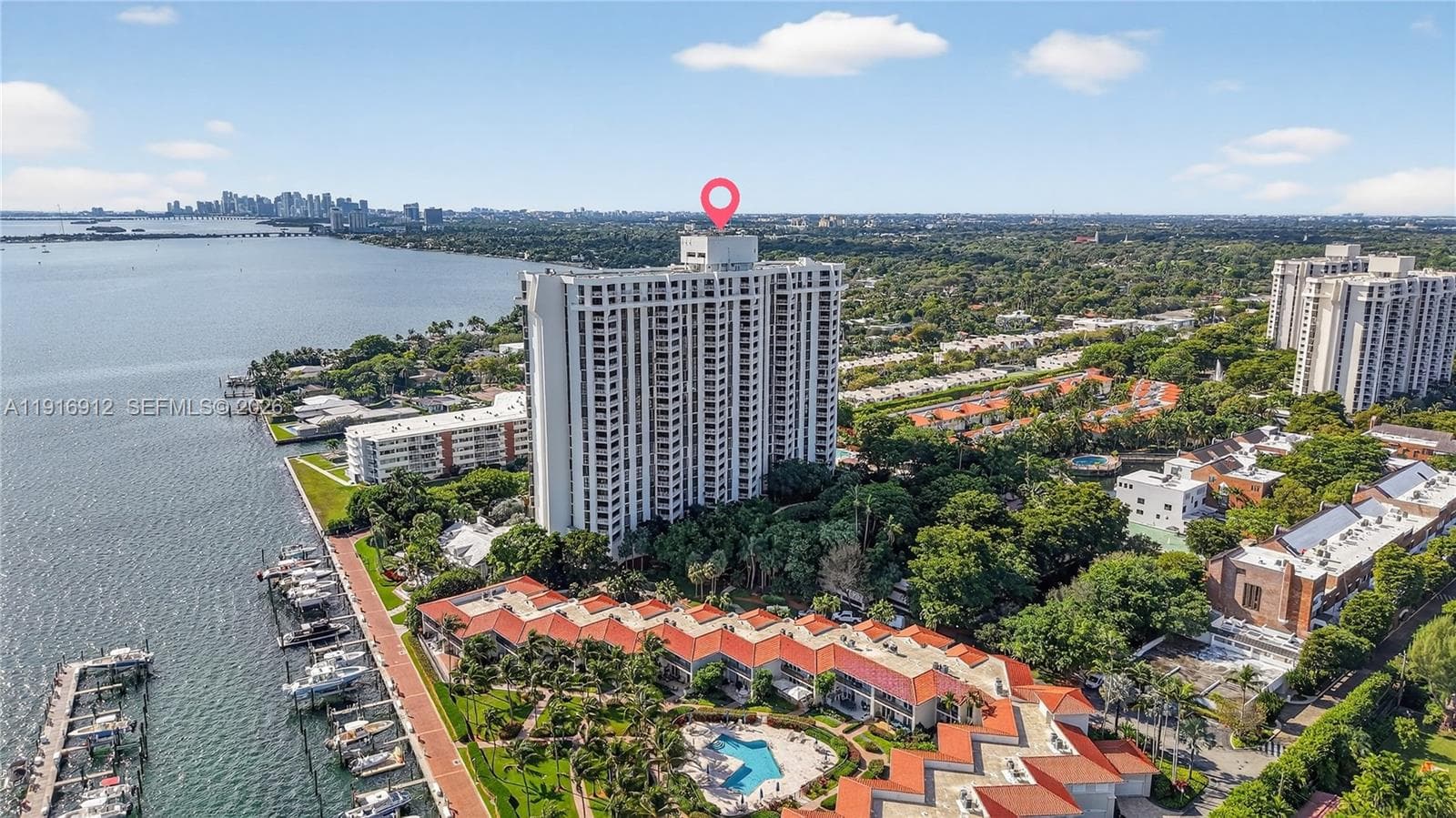 A stunning waterfront property featuring elegant architecture and private boat slips, seamlessly blending luxury living with direct access to the water