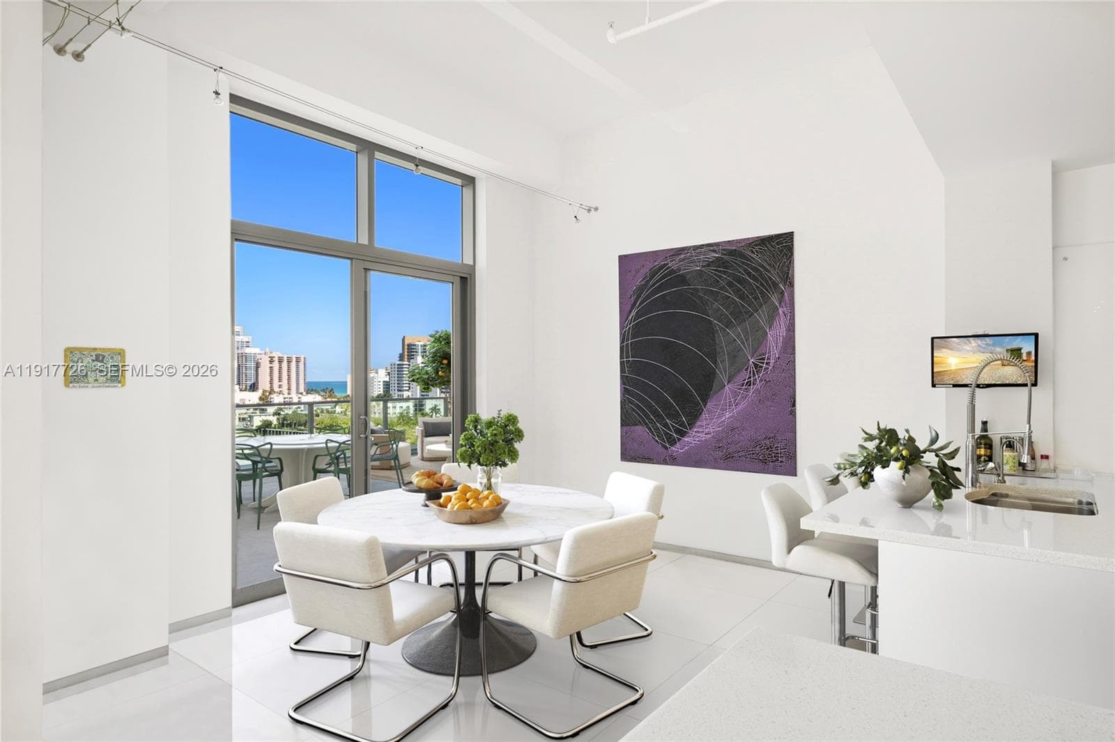 Virtually staged to highlight the kitchen dining area