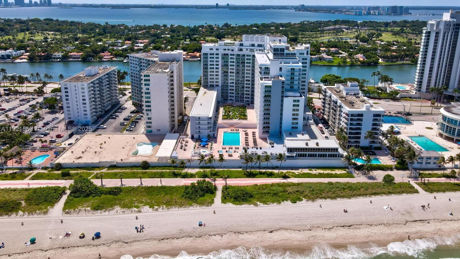 Unit located on top floor of the low-rise building to the left of the pool