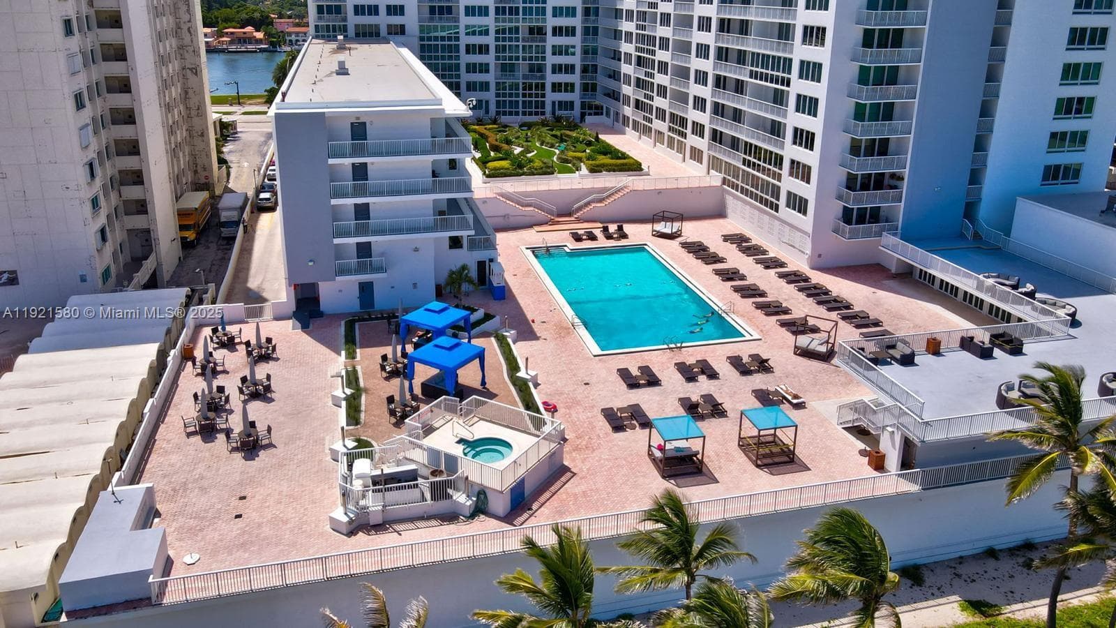 Unit located on top floor of the low-rise building to the left of the pool