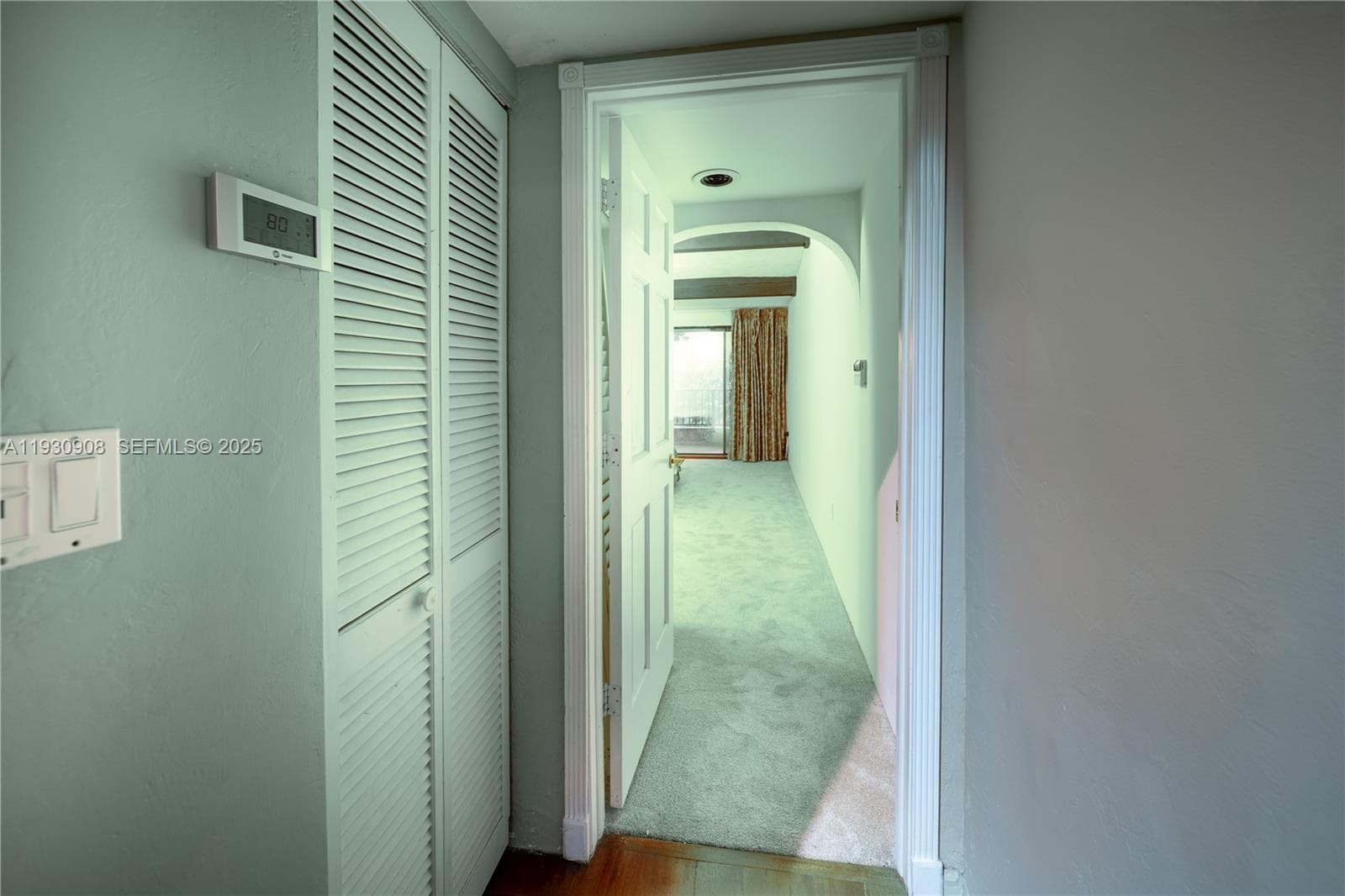 Corridor going to the primary bedroom