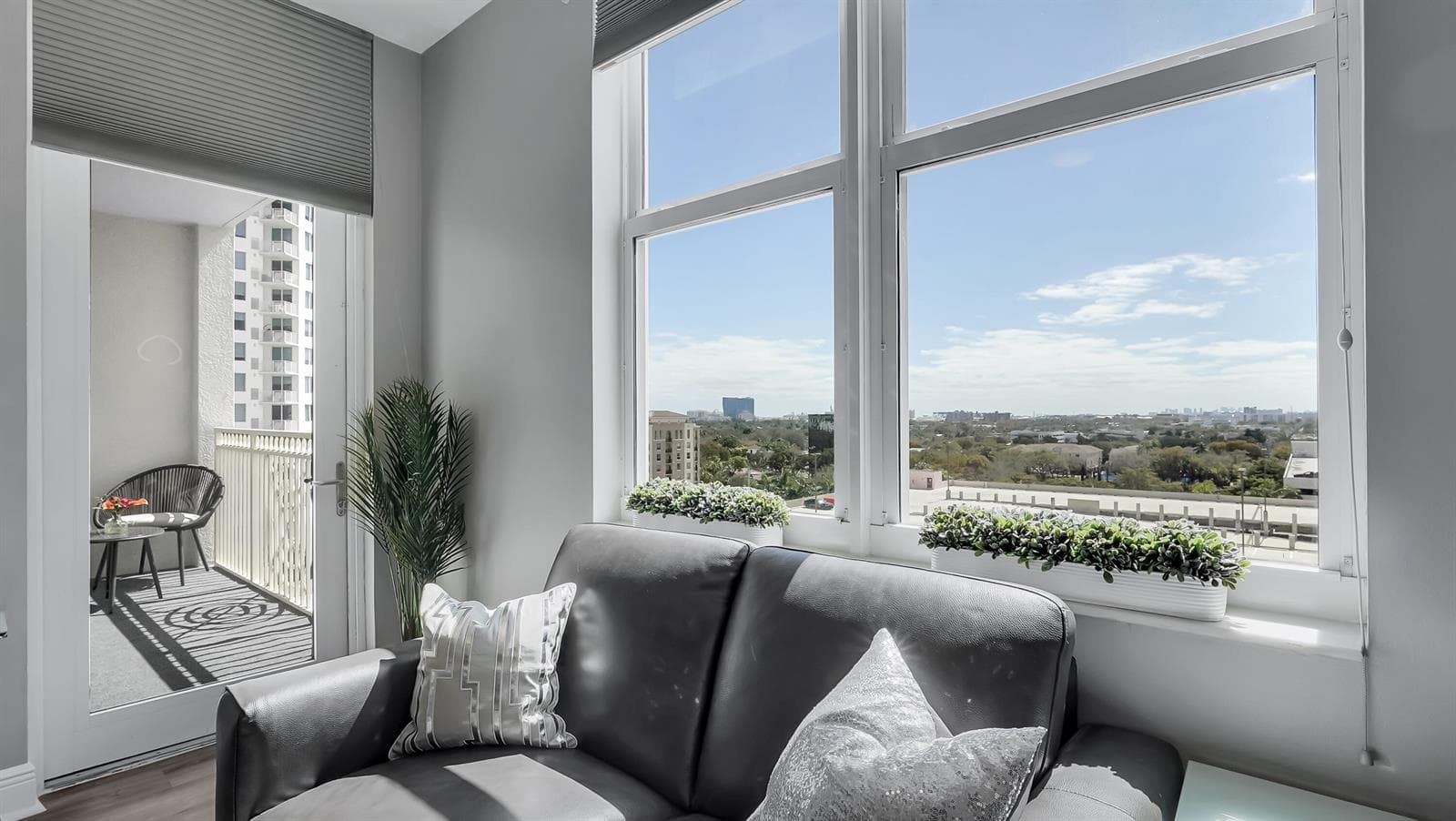 Living Room View Of Skyline & Balcony