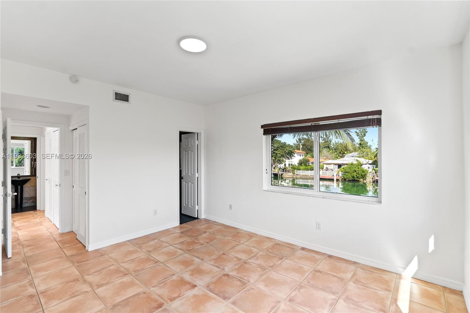 Spacious Bedroom with tons of windows and direct water views