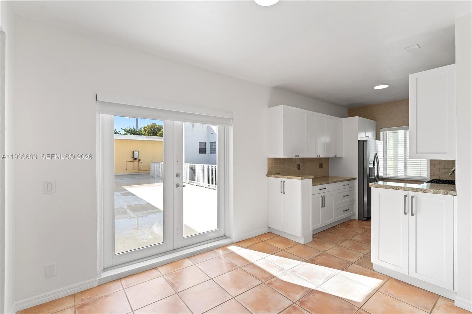 Kitchen and Dining Area leads to large outdoor patio