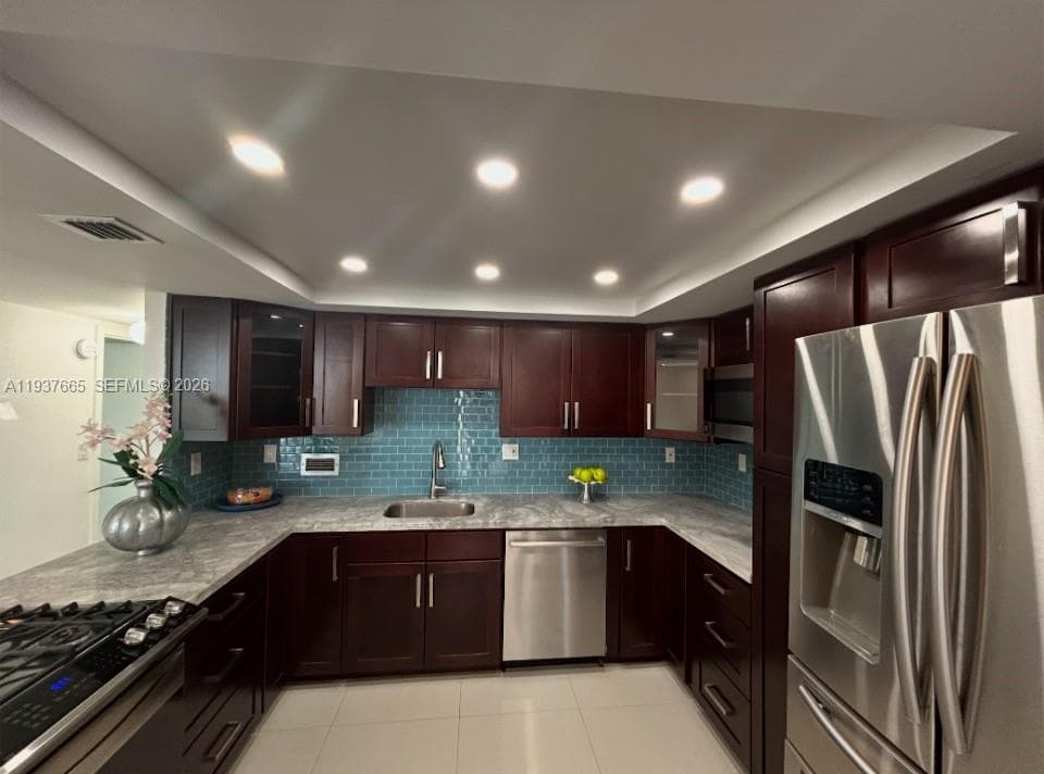 cherry wood cabinets and porceline floors throughout