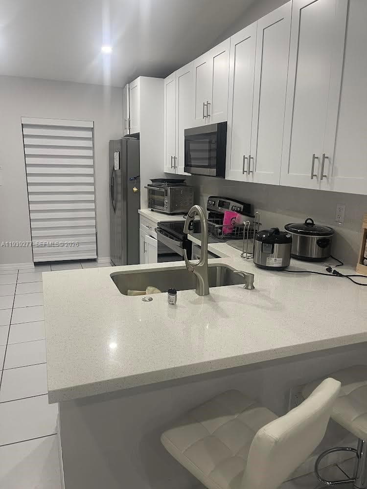 SOUTH LAKE VILLAGE CONDO · #203-2 in Miami - Photo 4