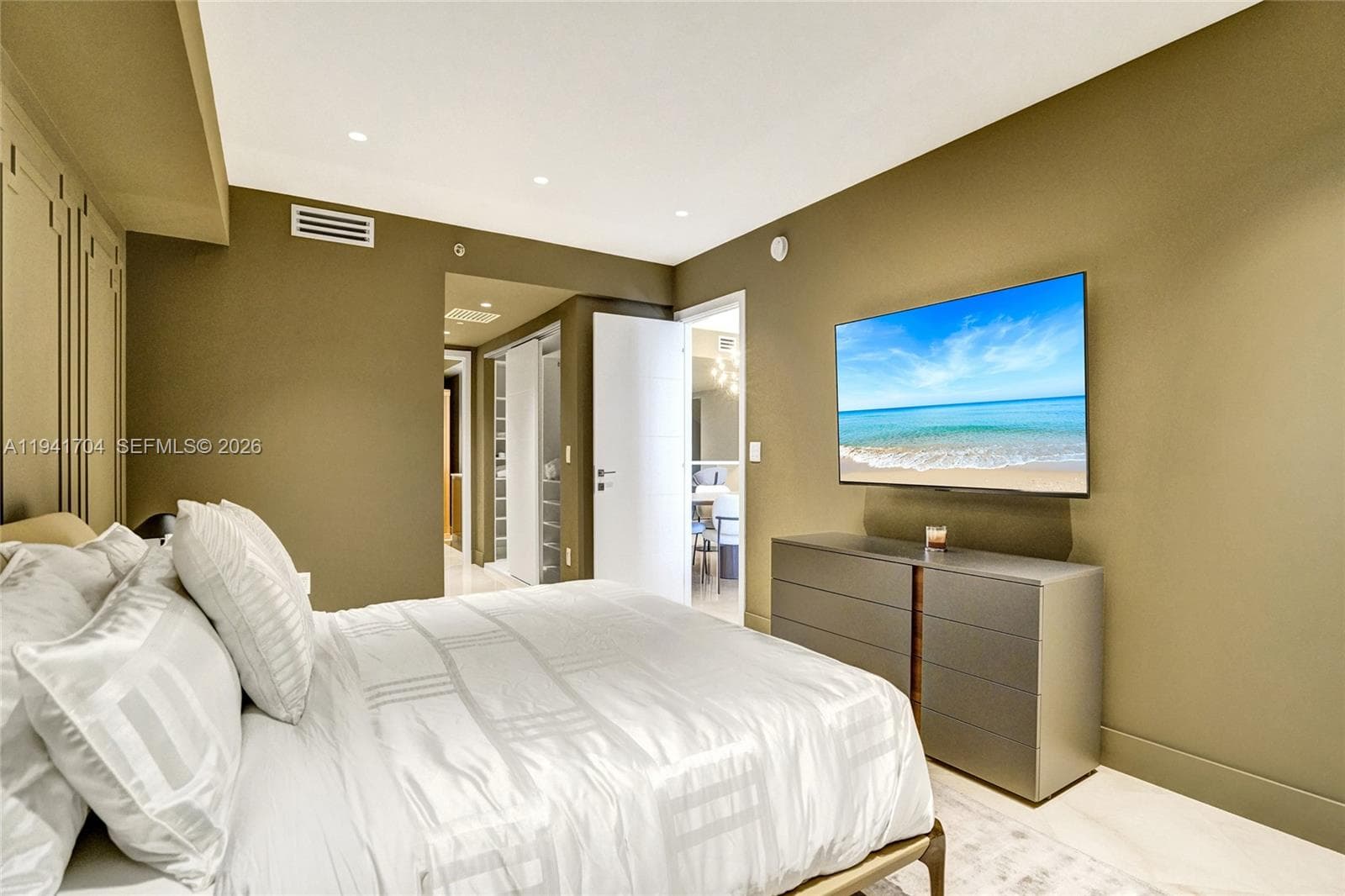 Primary Suite With Mounted TV