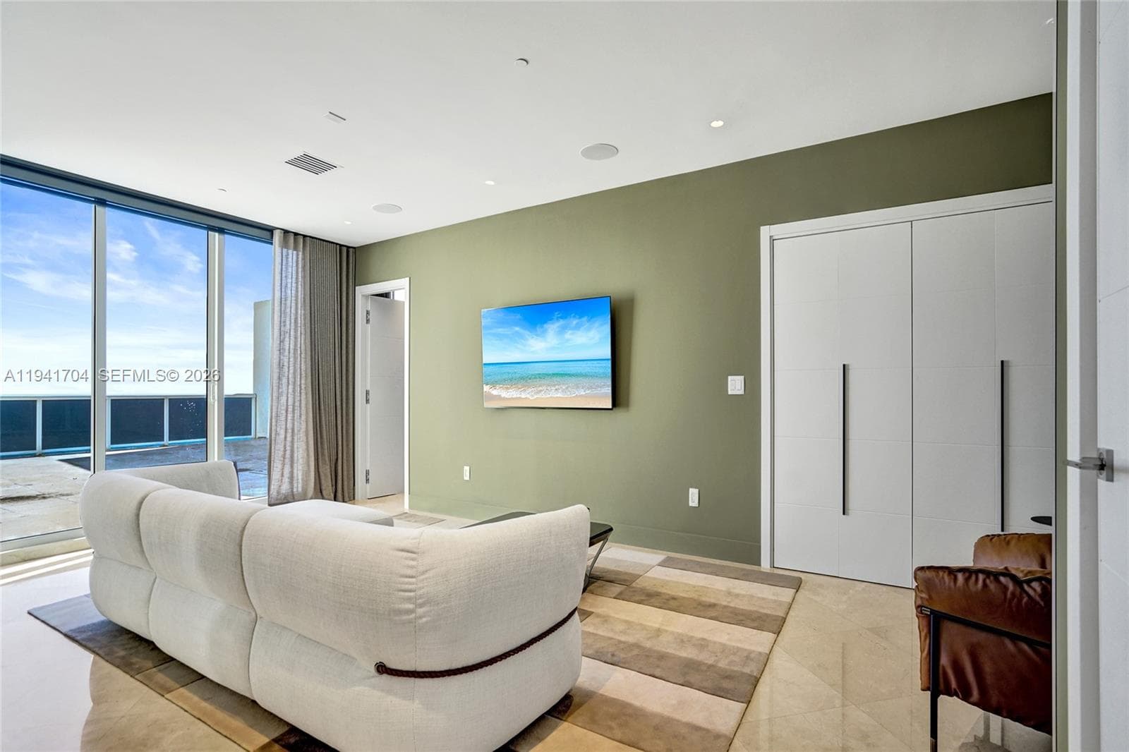 2nd Level Sitting Area With Mounted TV & Closet