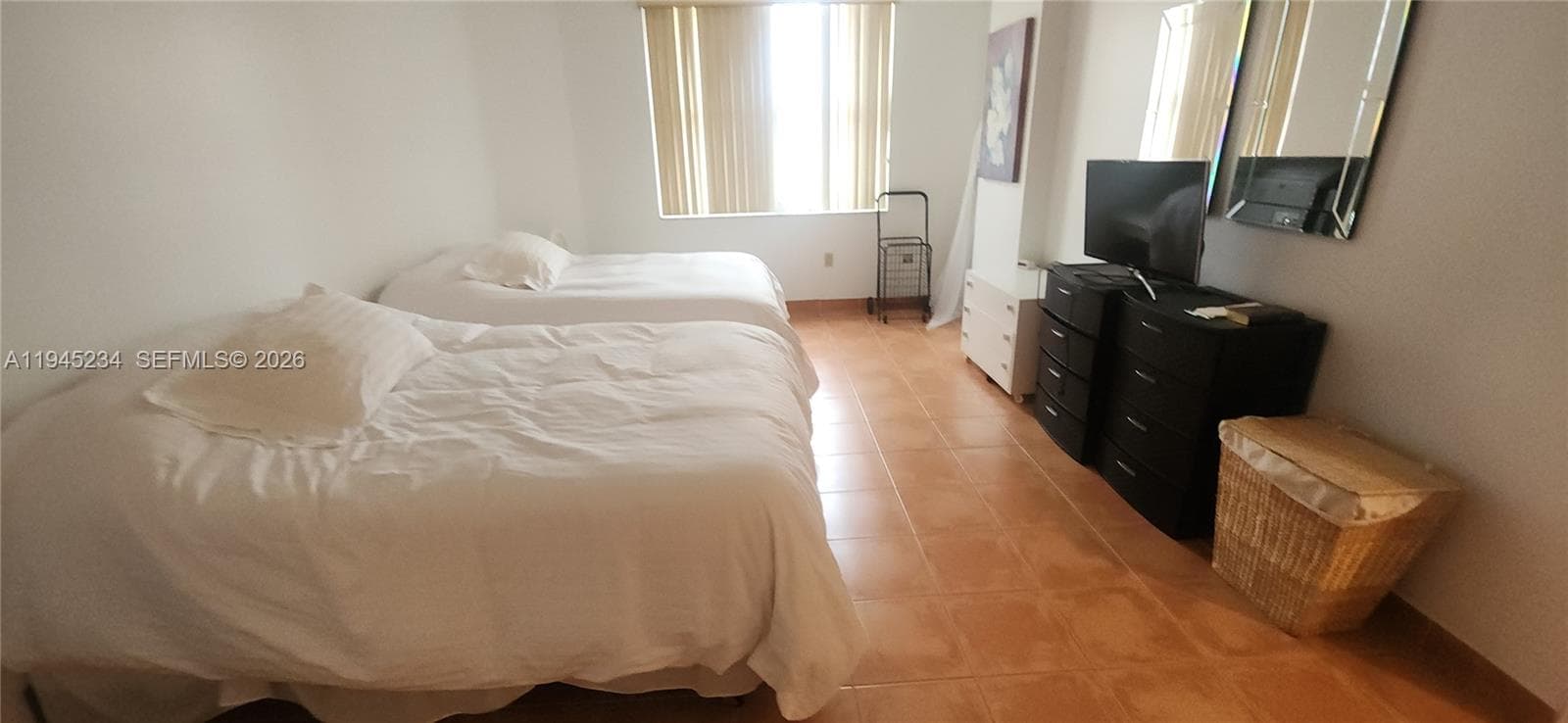 master bedroom with private bathroom and foyer area