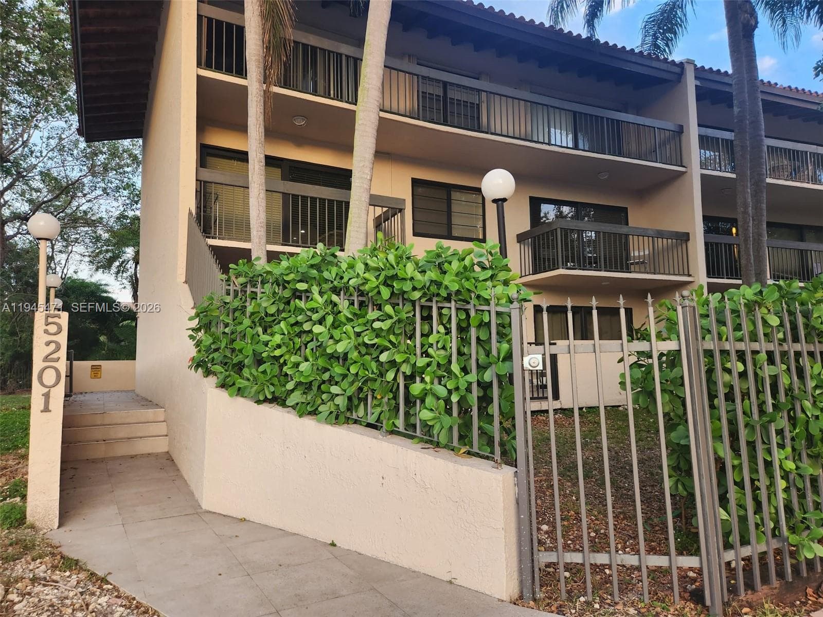 Walkway leads to front entry which has a telephone entry system for unit owner access.
