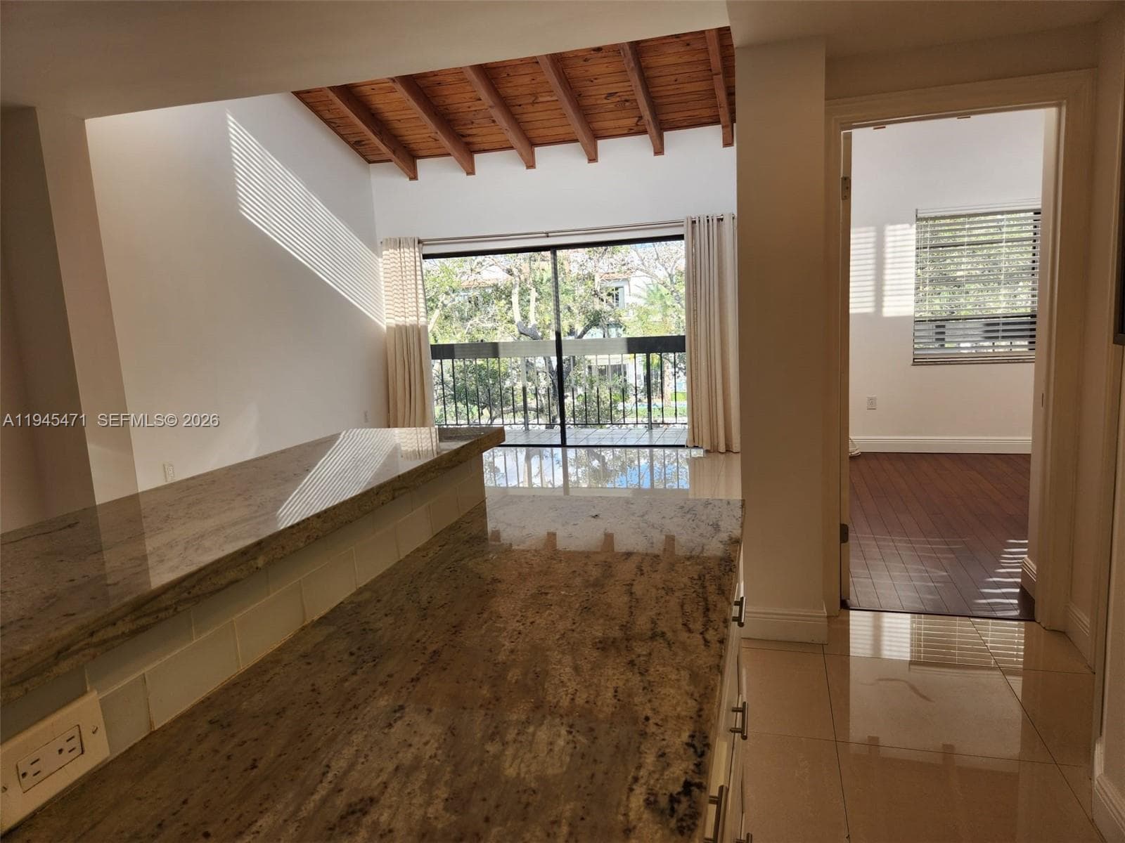 Additional view from the kitchen shows how the clerestory windows invite natural light into the room.