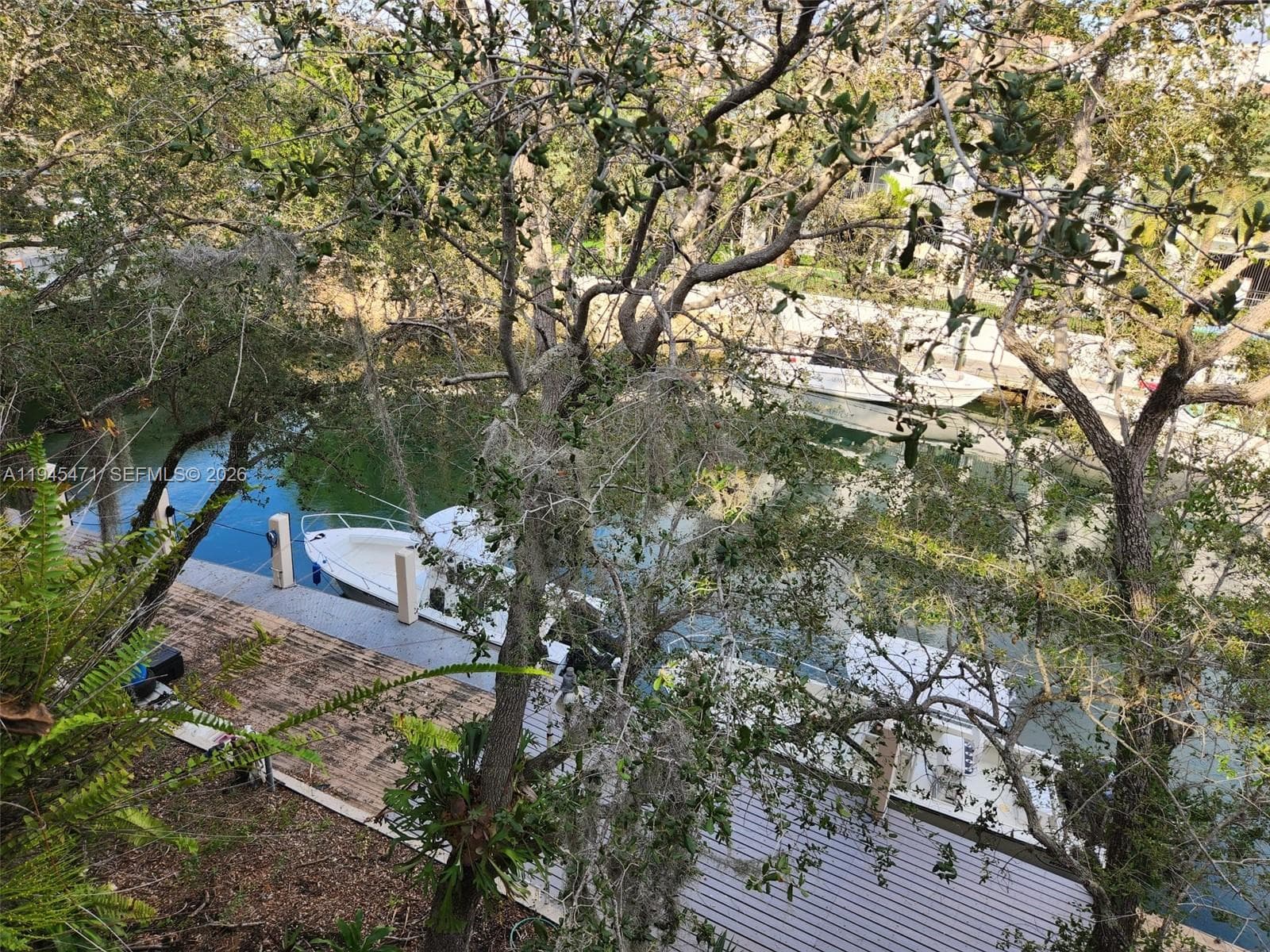 Direct view to canal and dock area from unit balcony.