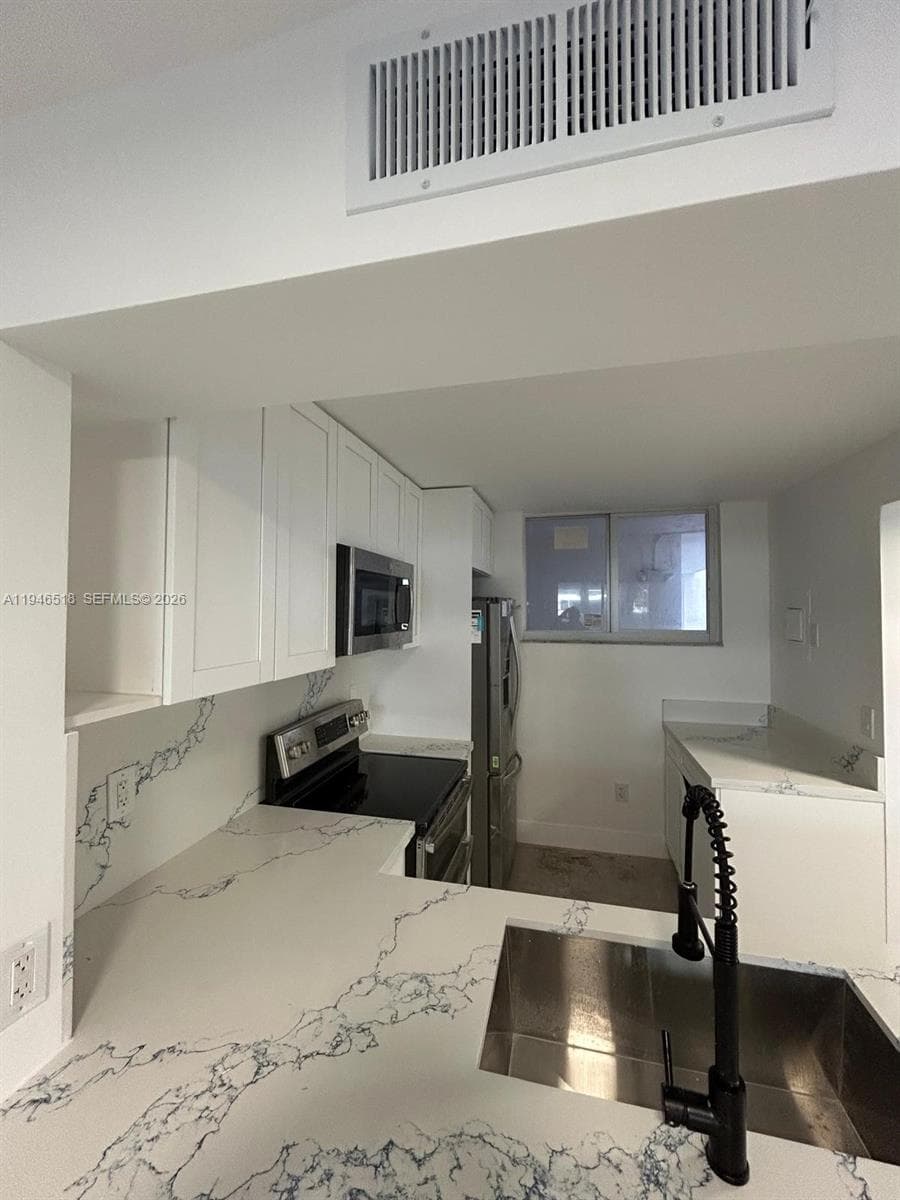 WEST BAY GARDENS CONDO · #210 in Miami Beach - Photo 26