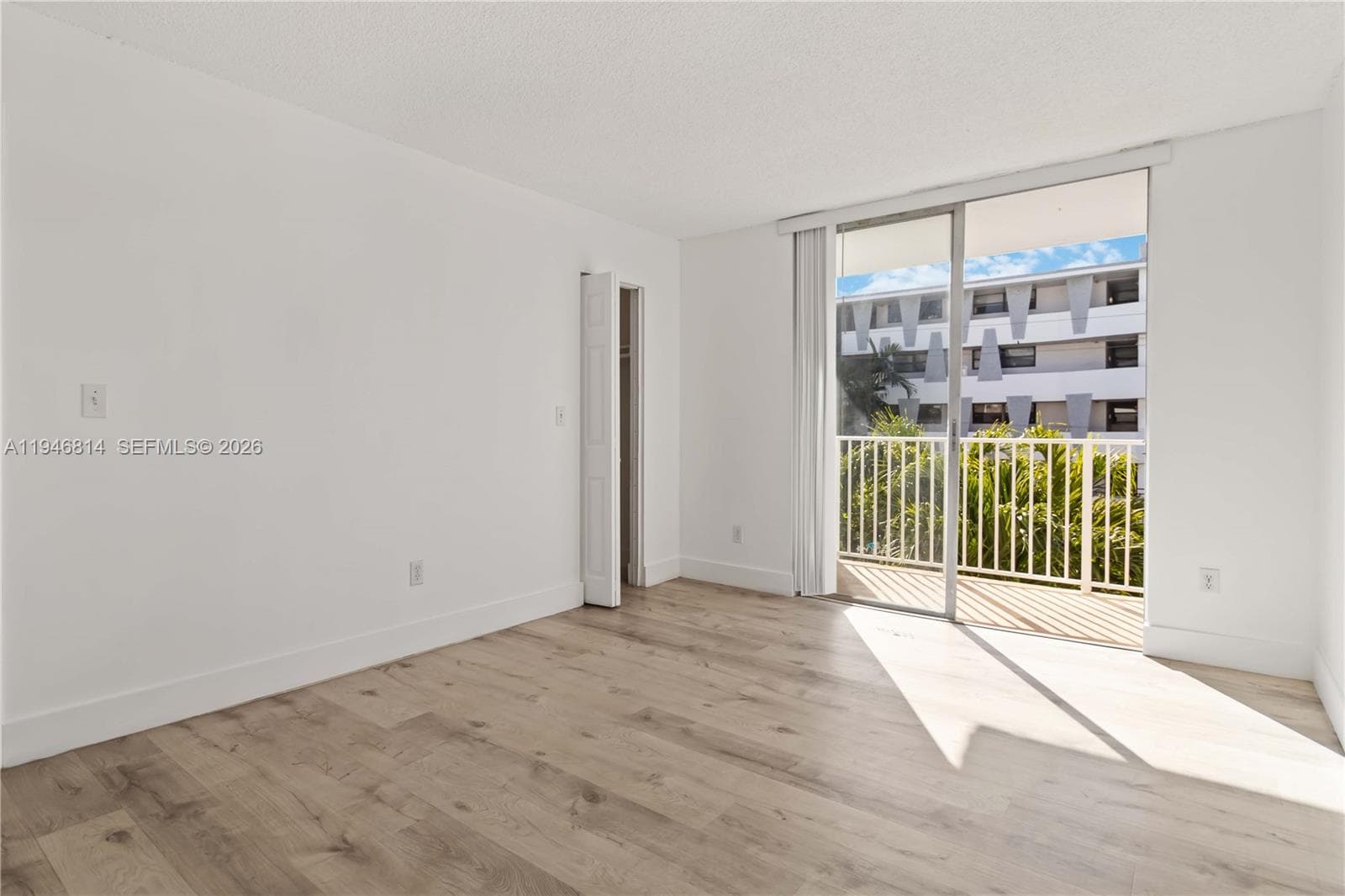 Bedroom with Balcony Access & Natural Light