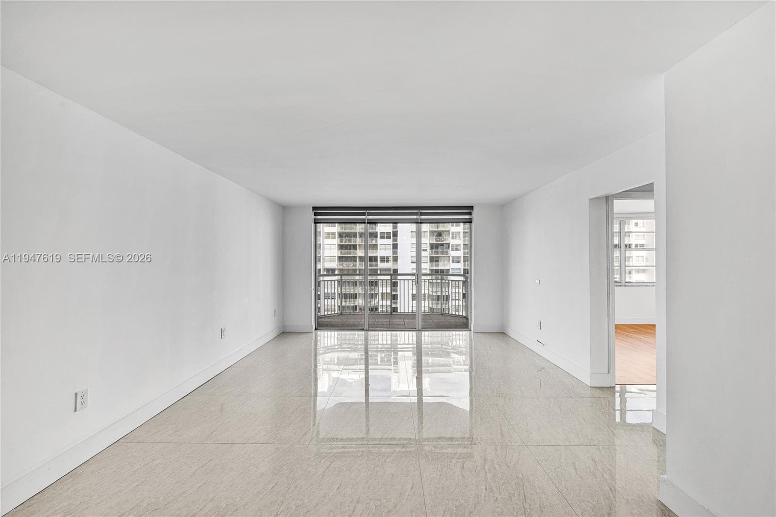 Spacious, light-filled living area with panoramic water views