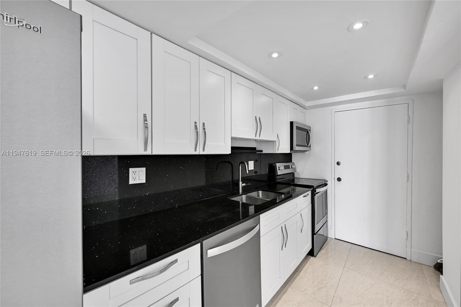 Black quartz countertops and updated cabinetry