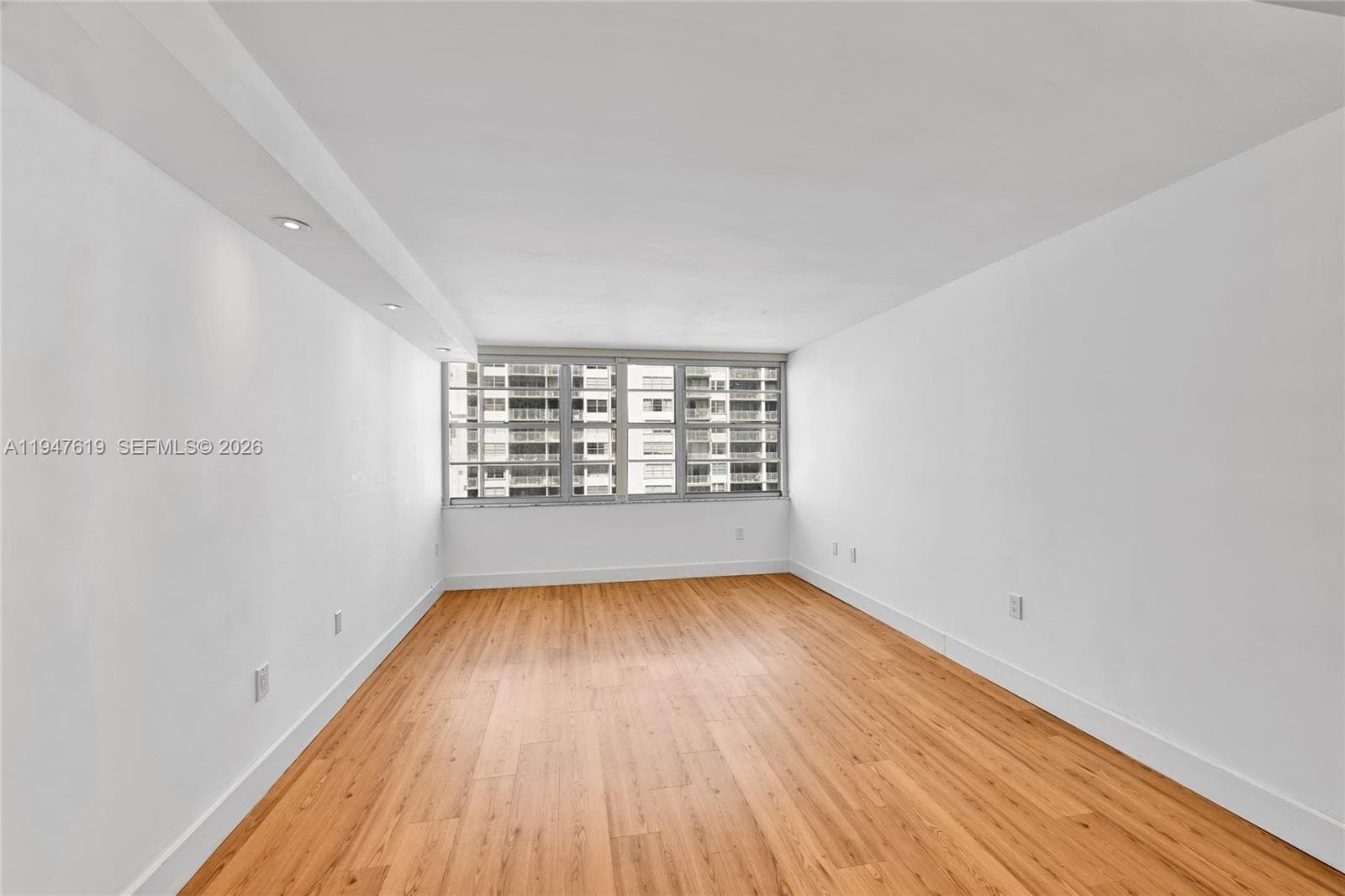 Spacious primary suite with tranquil views