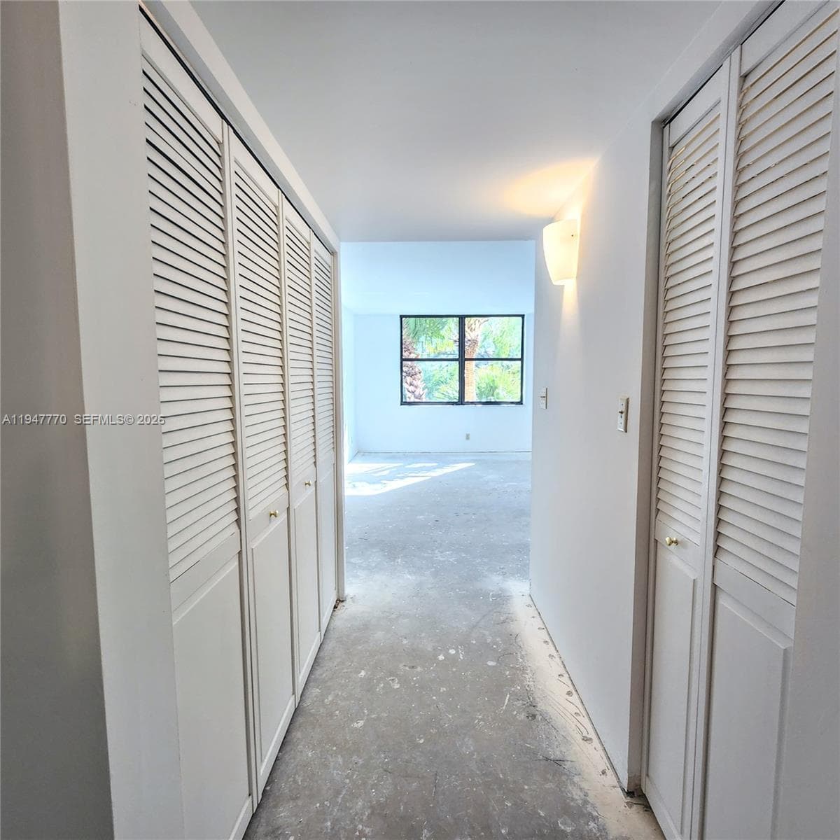 hallway with closets