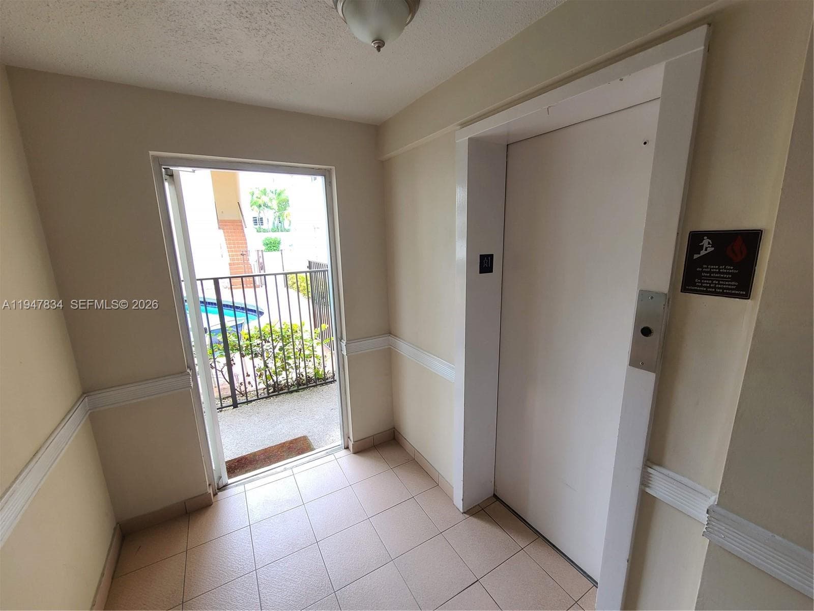 Elevator entry from Lobby & exit to Pool area / Courtyard