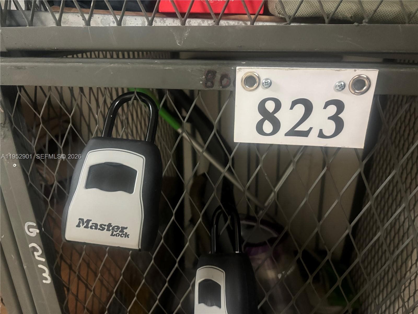 THE LOCK BOX NEXT TO THE 823 NUMBER.