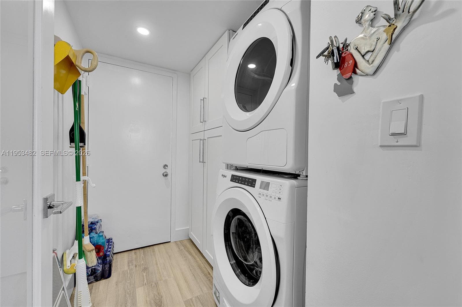 In-unit utility room with storage area