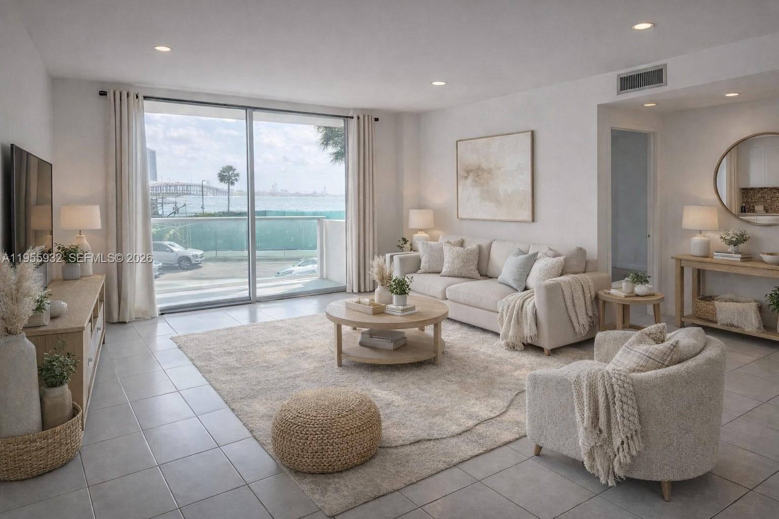 Dining and living room shows natural light flowing into the unit.