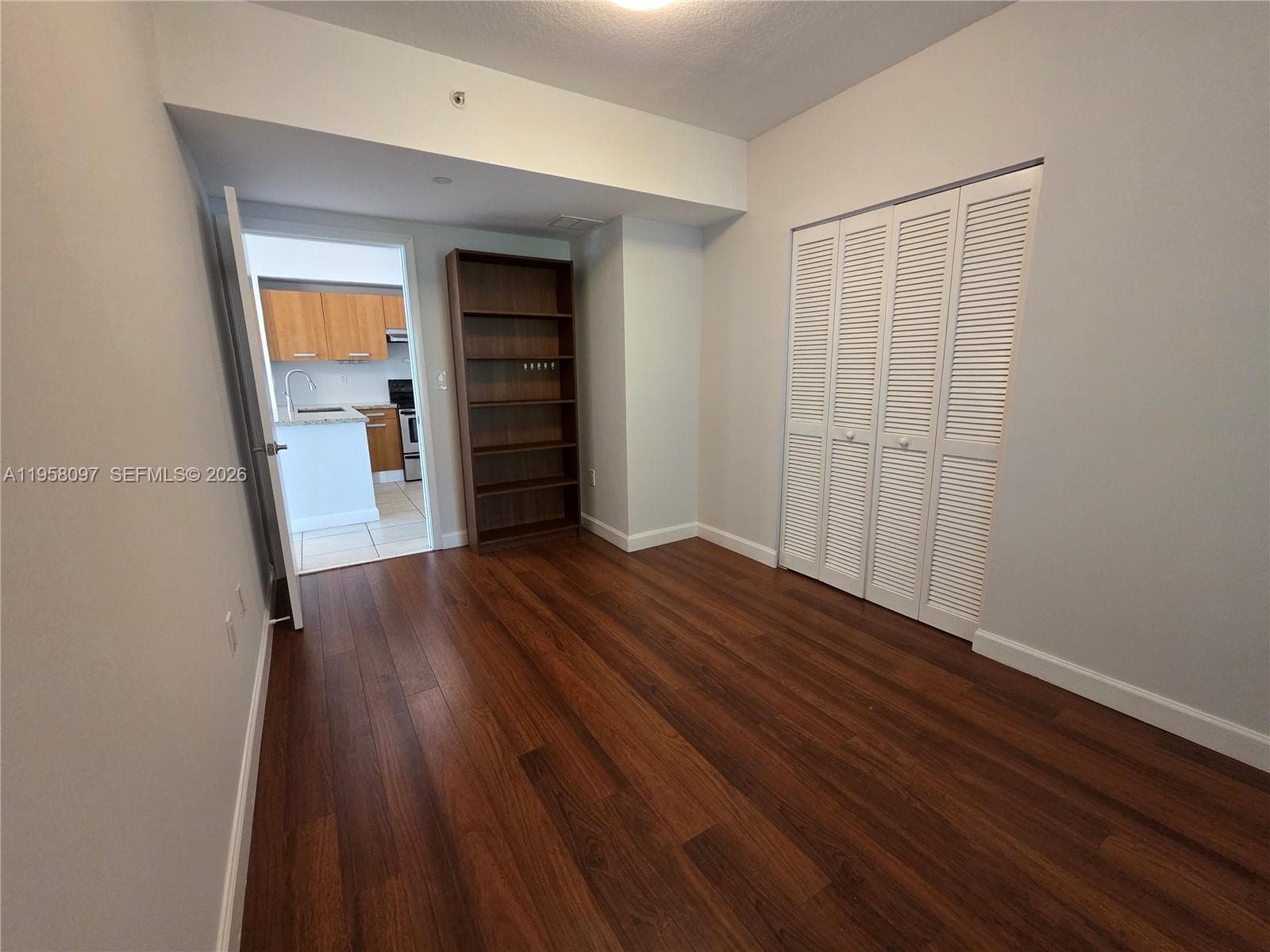Spacious bedroom layout with convenient access to closet and living areas.