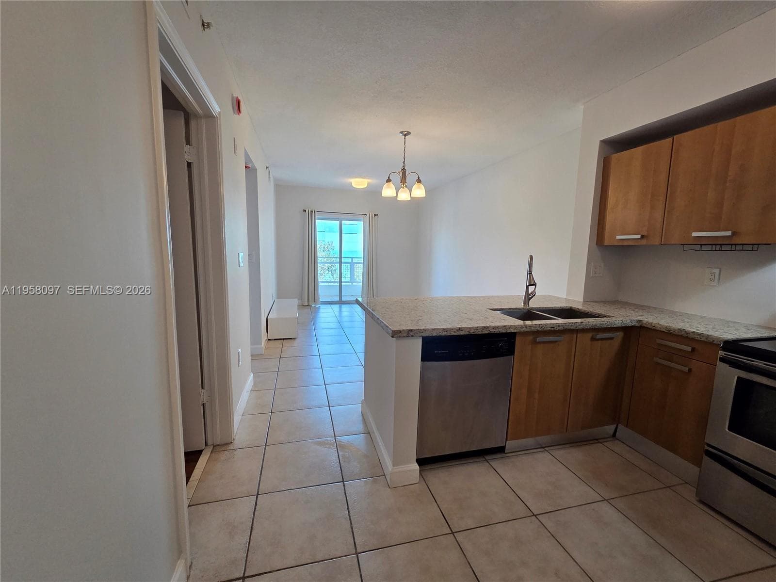 Functional U-shaped kitchen layout maximizing cabinet space and countertop prep area.