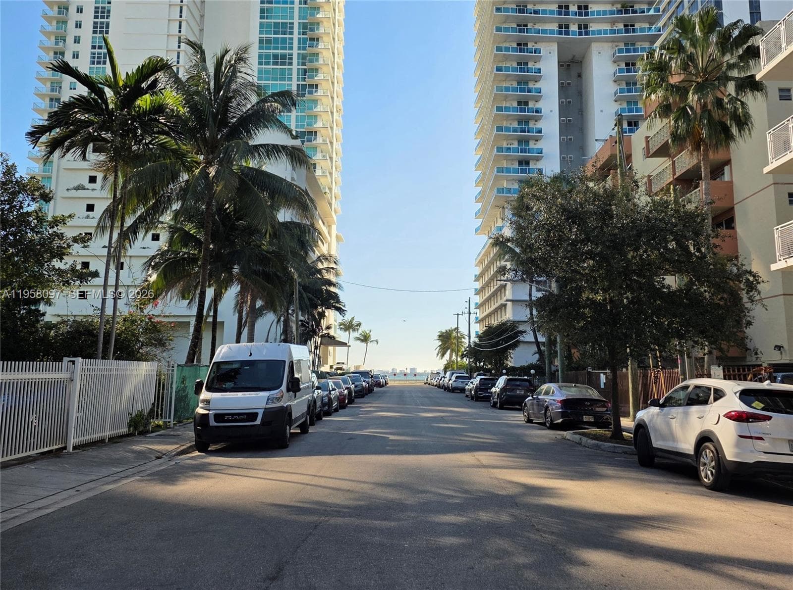 Bay view framed by luxury high-rise buildings.