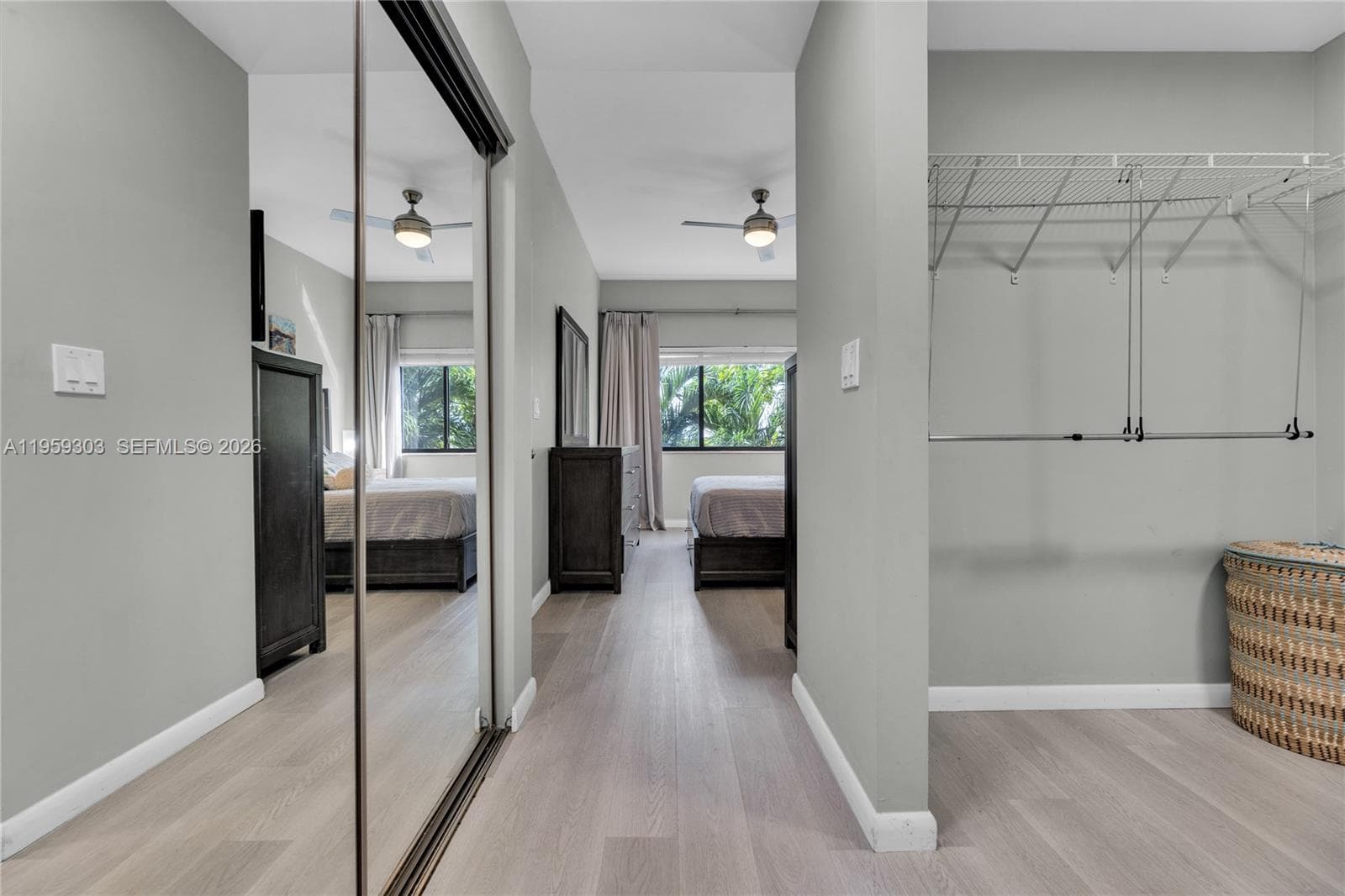 View exiting bathroom. Open walk in closet to the right and bonus closet to the left