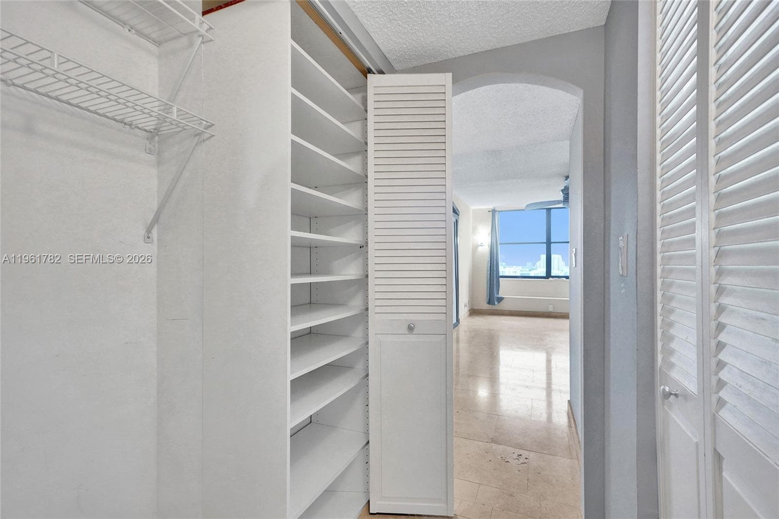Hallway spacious organized California closet