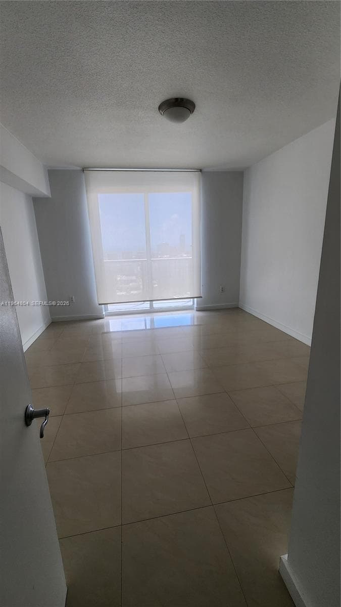 This spacious bedroom features incredible open views to the bay and city.