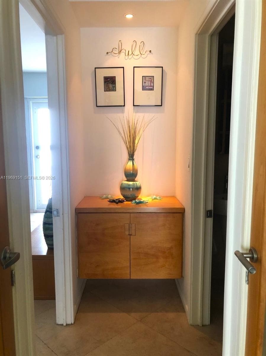 Hallway to bedroom and bathrooms