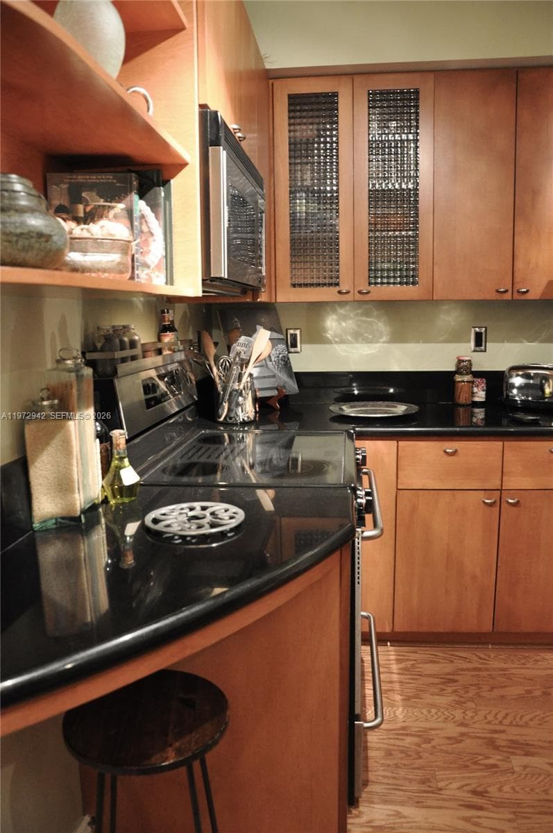 Stainless Steel Appliances w/ Granite Countertops and Solid Maple Cabinetry