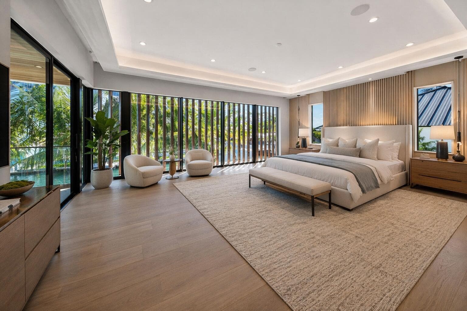 Modern airy bedroom with waterfront view