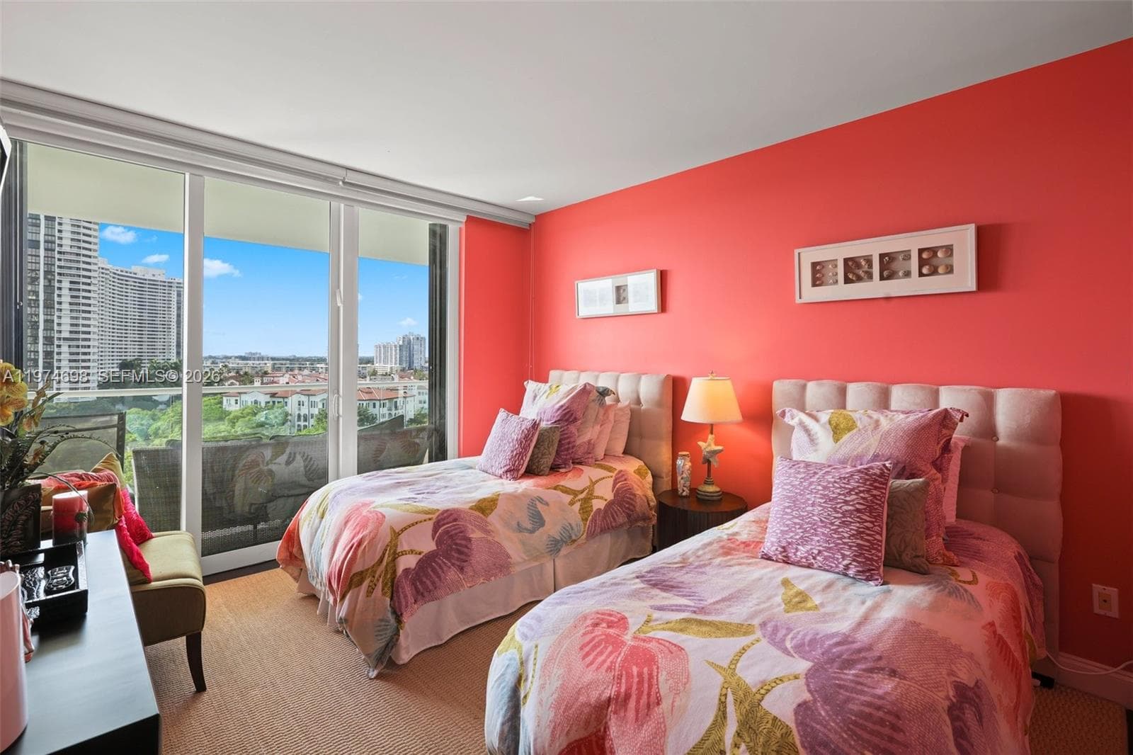 Third bedroom with balcony access and city views