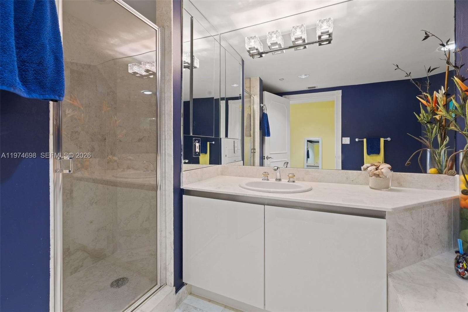 Secondary bedroom Ensuite, 4-piece bath featuring Glass-Enclosed Shower and vanity