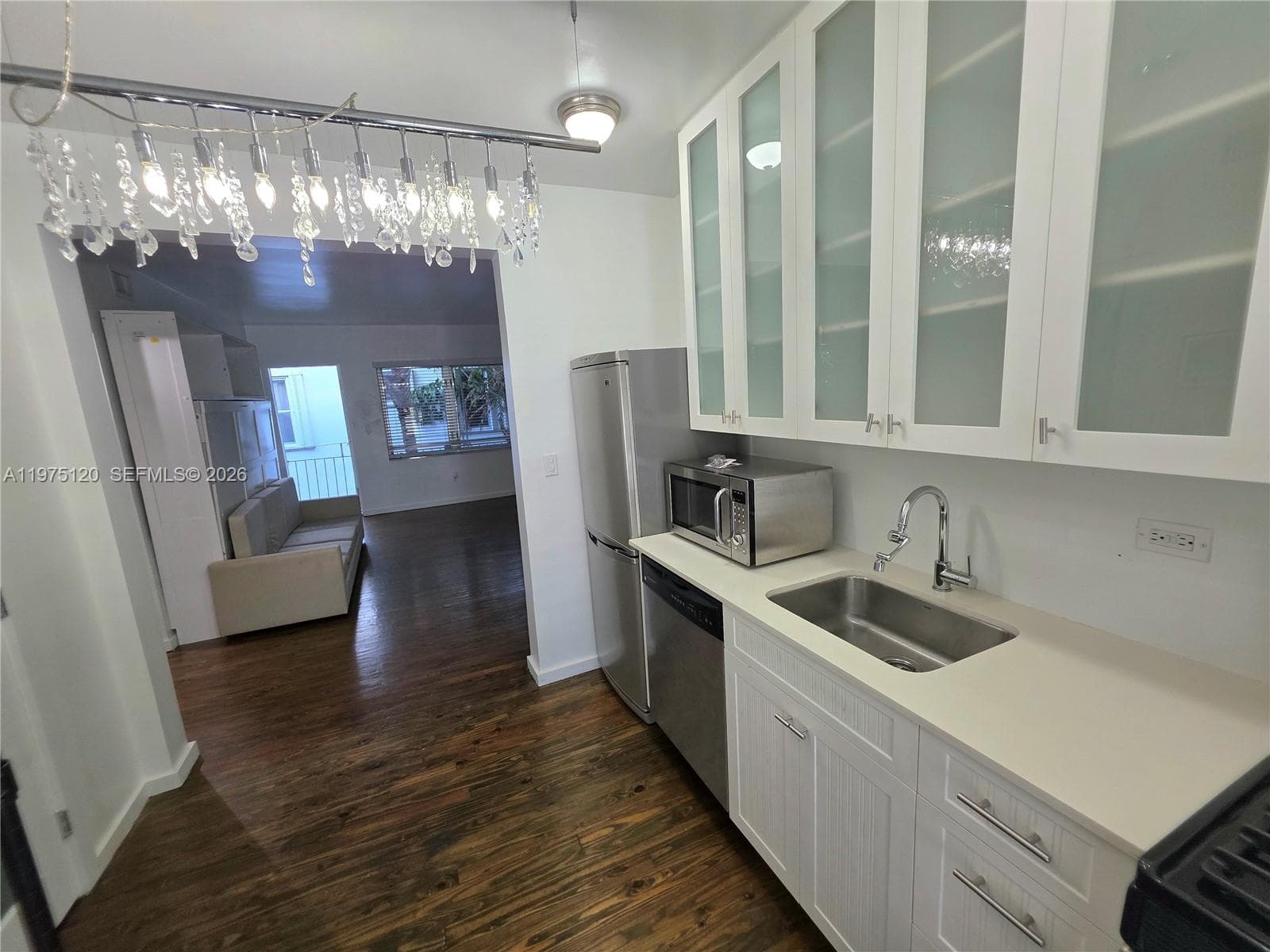 Nicely updated kitchen with second exit to balcony leading to stairs (North Exit from Apt). Gas stove/range