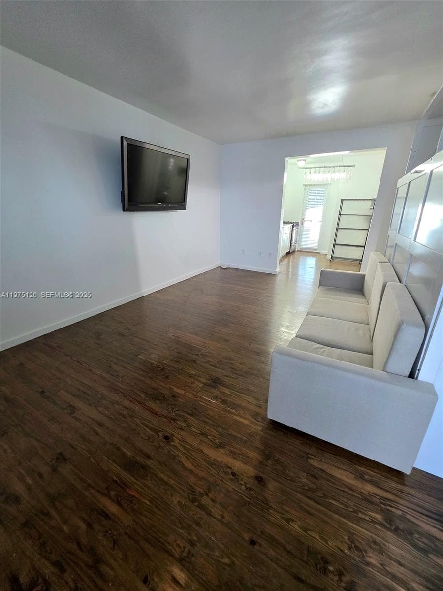Main area living-bedroom area. Murphy bed and wall TV