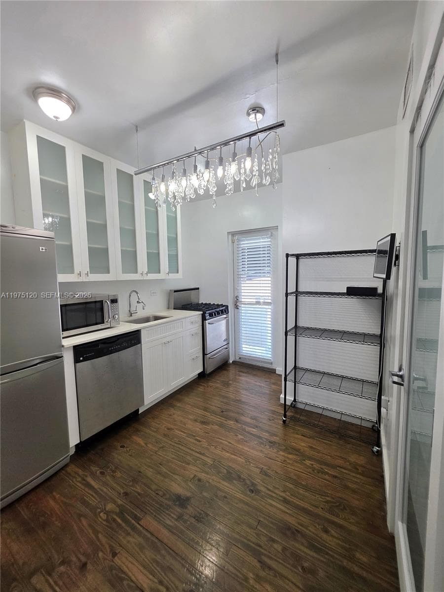 Nicely updated kitchen with second exit to balcony leading to stairs (North Exit from Apt)