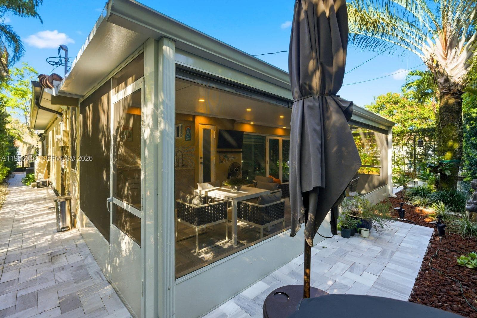 EXTERIOR BACK PATIO WITH BUILT IN BARBECUE AND HALF BATHROOM